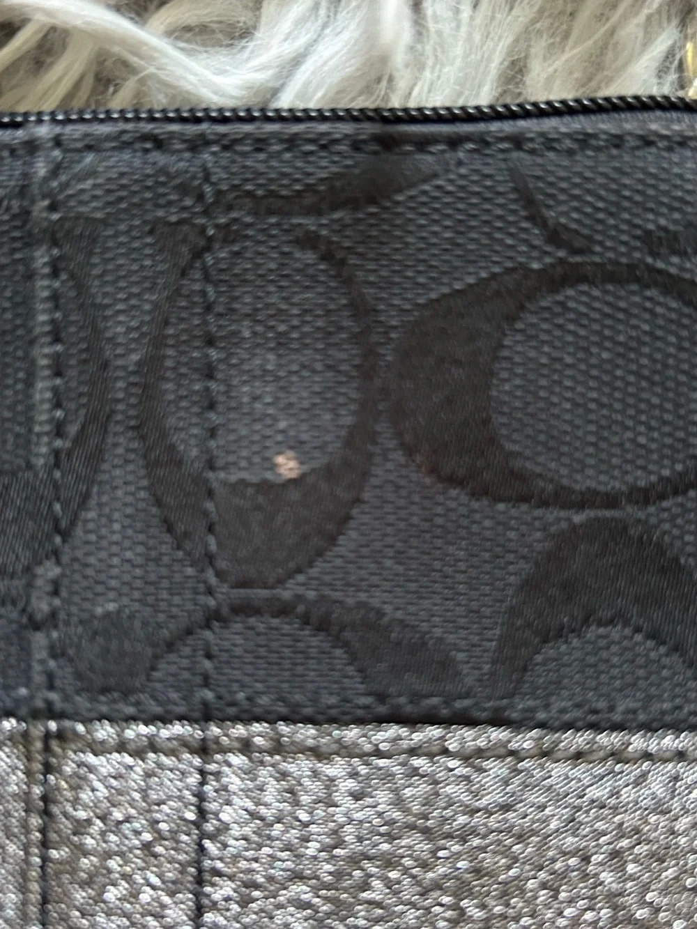 Coach wristlet featuring